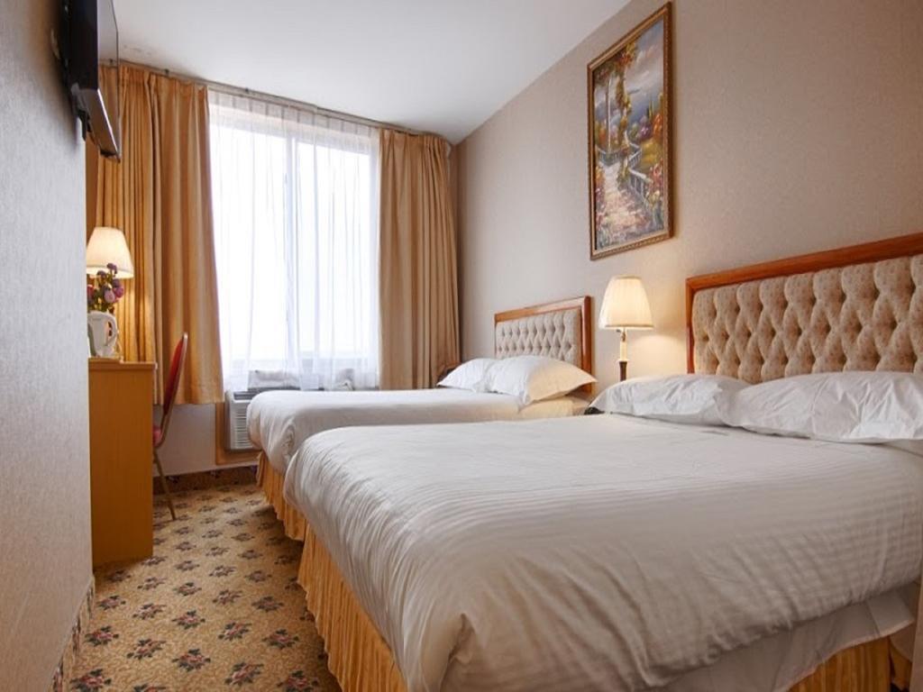 Kamer met 2 Queensize Bedden