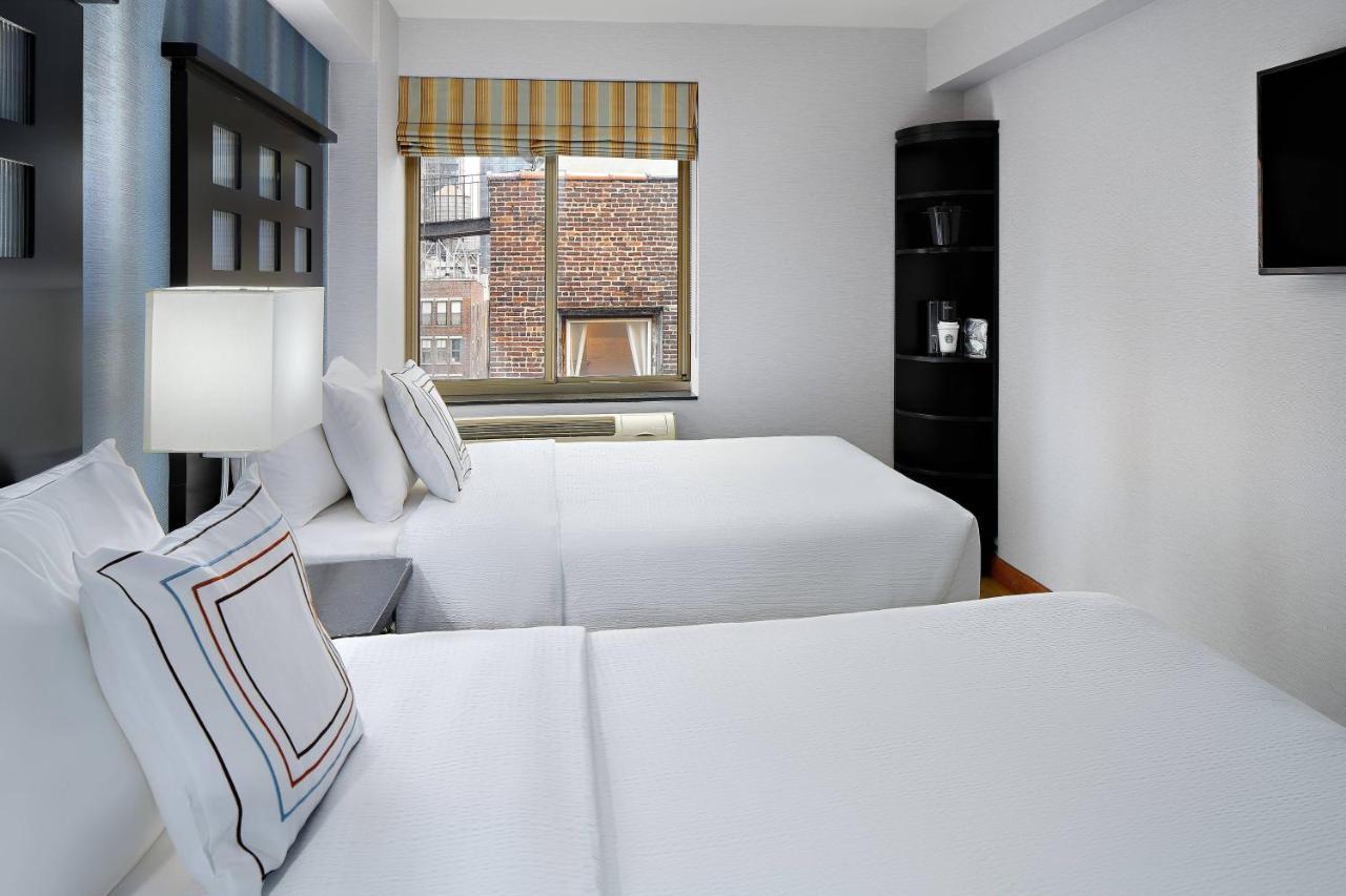 Suite met 1 Slaapkamer en 2 Tweepersoonsbedden - Slaapbank