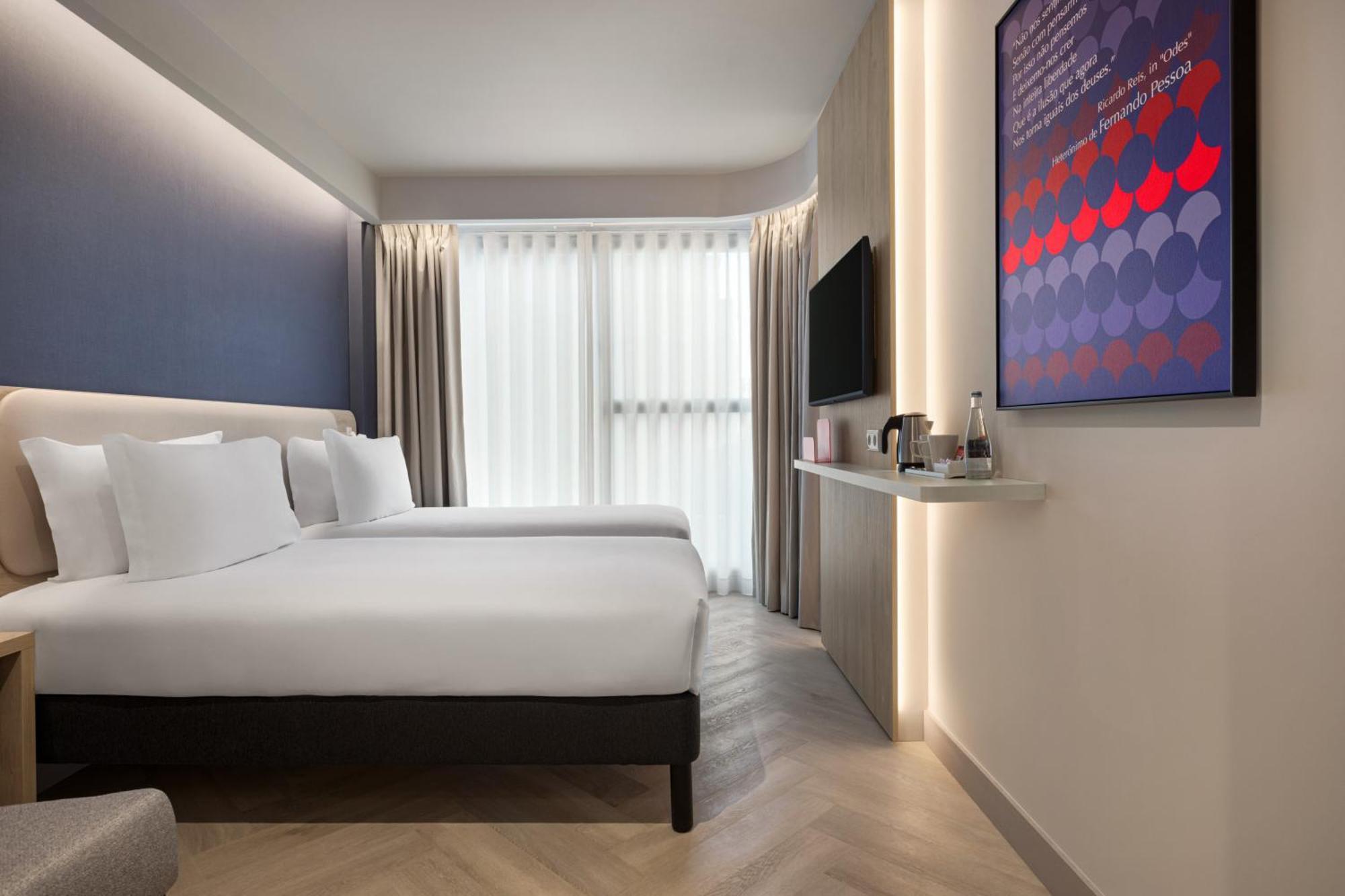 Standaard kamer met twee aparte bedden en een slaapbank