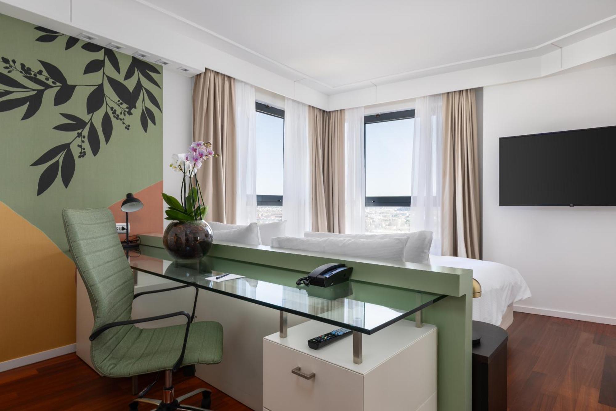 Executive Hoekkamer met Kingsize Bed en Uitzicht op de Stad