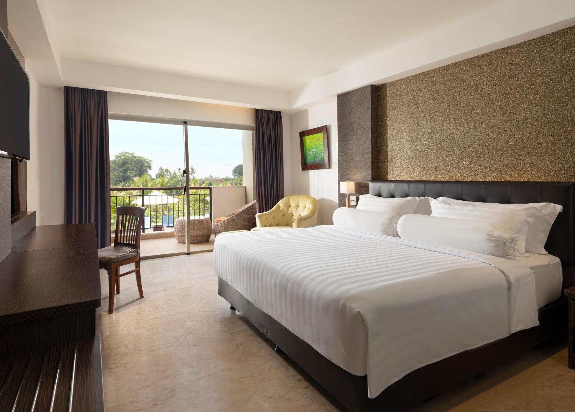 Deluxe King Balcony Room Pool View daily shuttle to Ubud City Photo Session Art Gallery Visit 24-hour access to Fitness Center Welcome Drink Kids Activities