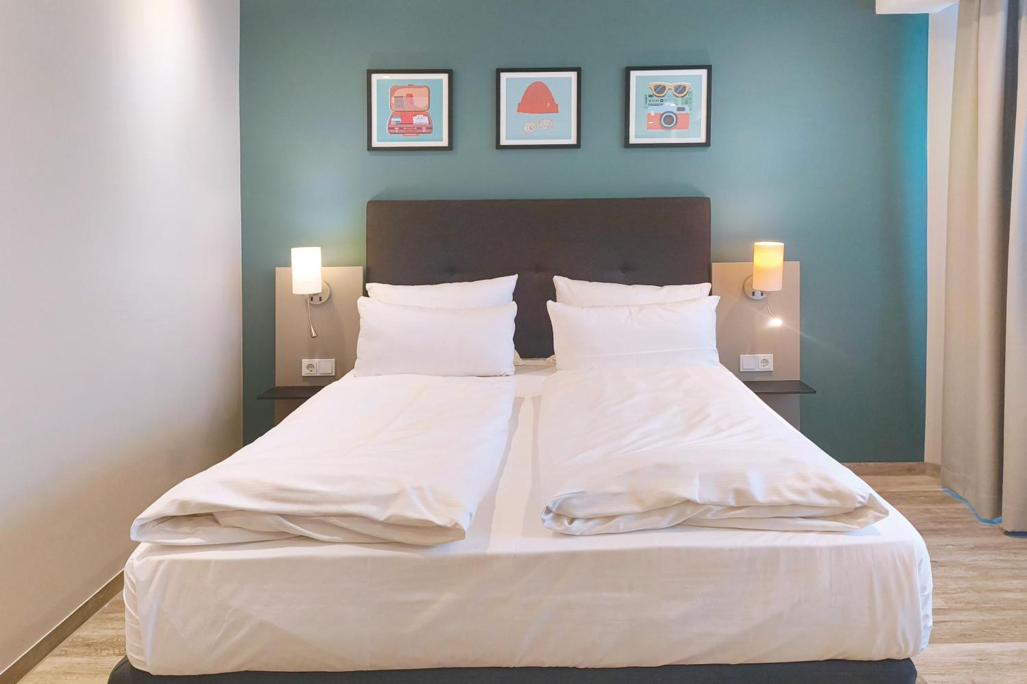 Premium Family Room with One Queen Bed and Two Twin Beds