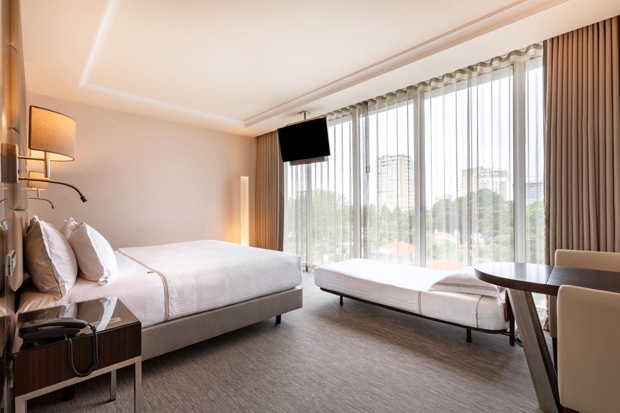 Tweepersoonskamer met 1 of 2 Bedden en een Extra Bed
