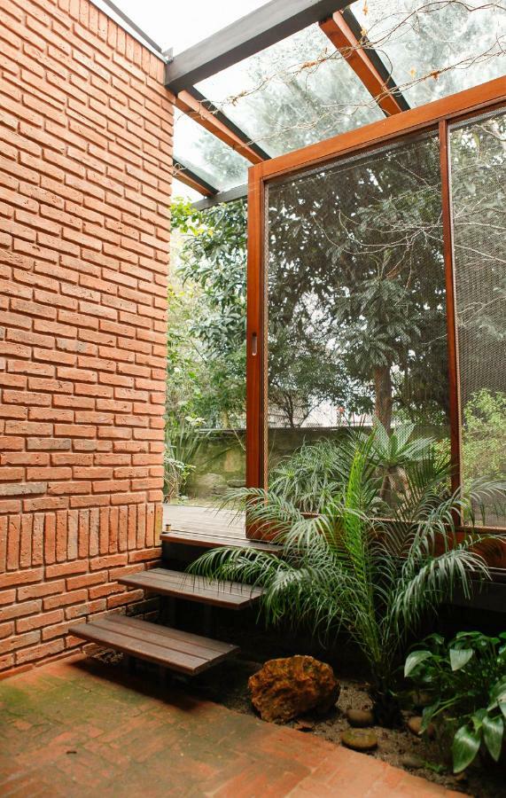 Tweepersoonskamer met een Patio en Uitzicht op de Tuin